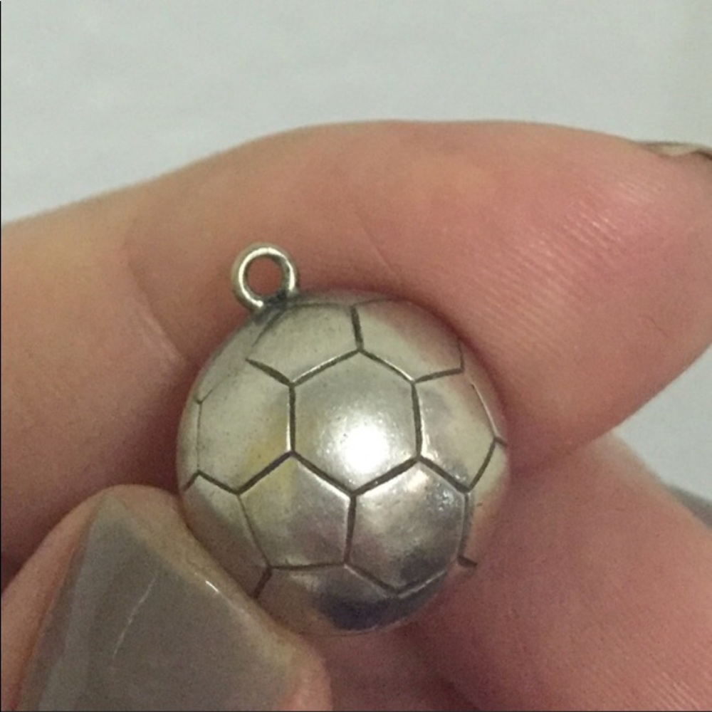 Sterling silver soccer ball charm.